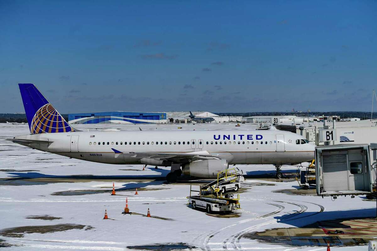 Aircraft are parked at San Antonio International Airport on Monday, Feb. 15, 2021, after inches of snow fell overnight. The airport is closed; it lacks sufficient equipment to make the runways and taxiways usable.
