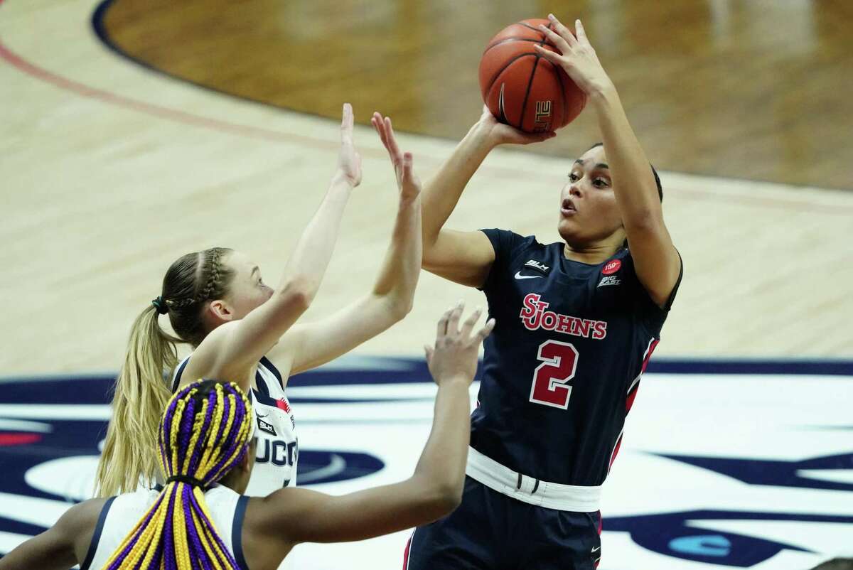 St. John’s’ Leilani Correa (2) shoots over UConn’s Paige Bueckers (5) on Feb. 3 in Storrs. UConn defeated St. John’s 94-62.