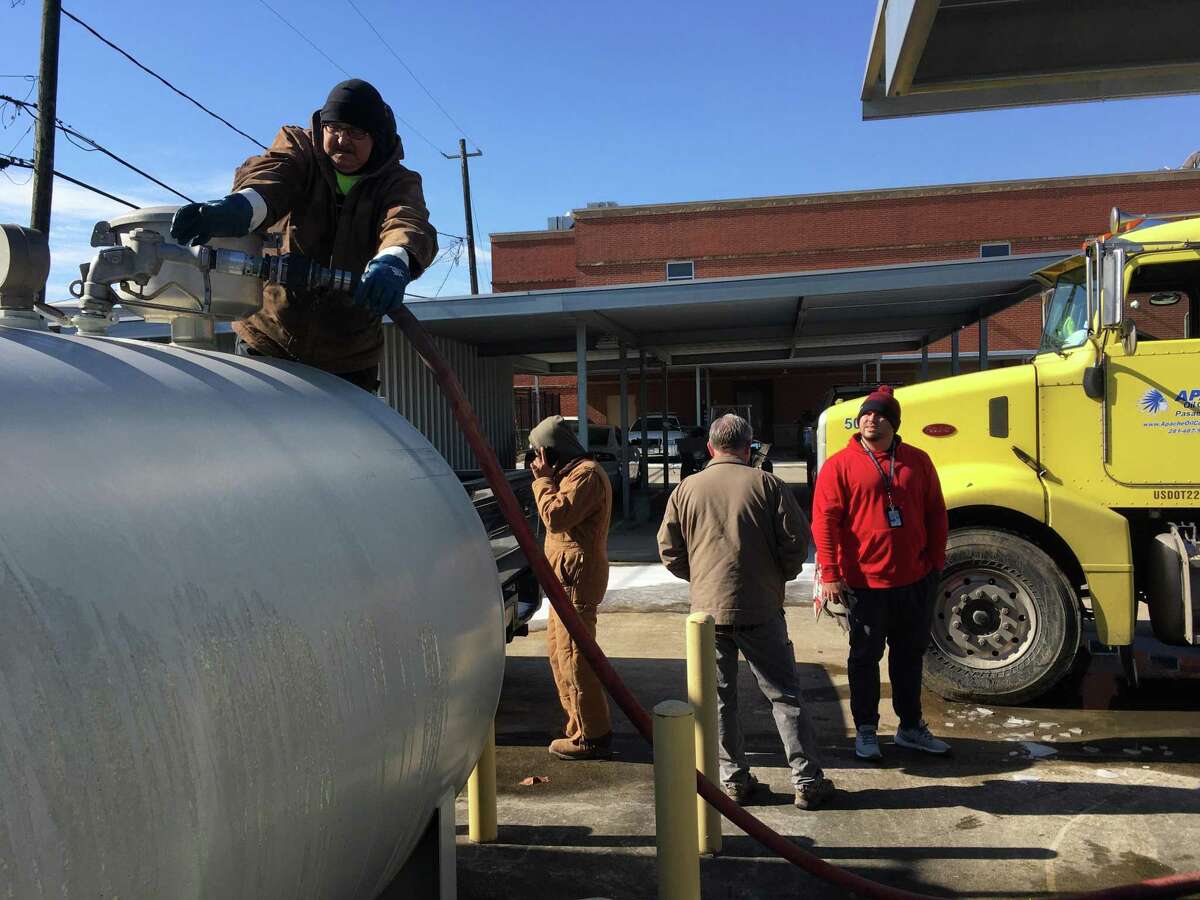 South Houston employees watch as a fuel tank at the city police department gets refilled. At one point, officials worried they might not be able to get fuel to run infrastructure for critical services, including the small city’s police station and waste treatment station, Tuesday, Feb. 16, 2021.