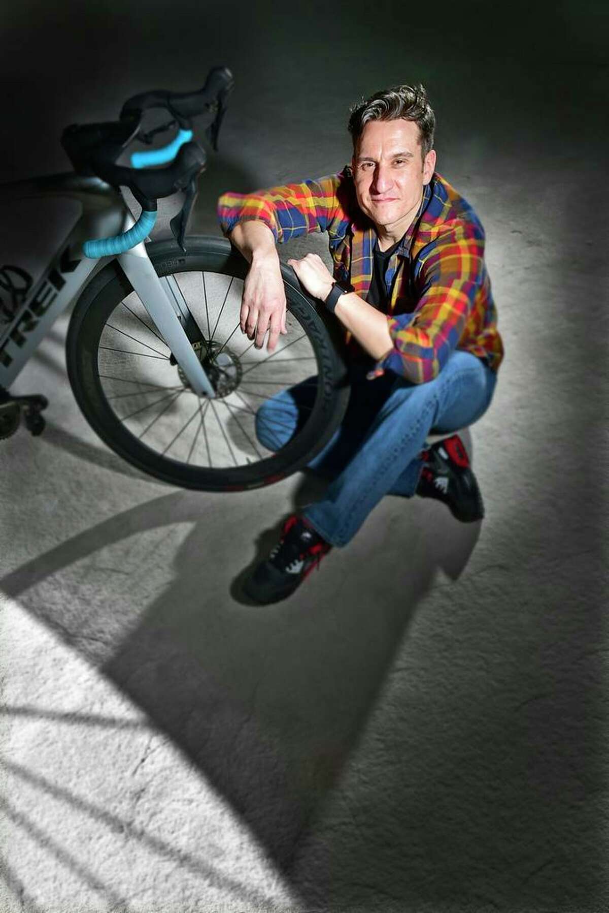 Photographer Noah Ehlert of Guilford in his studio. He did a 3,100 mile bike journey to California Family Recources' SAfePlace2B shelter, where he lived as an 11-year-old runaway, returning to share his story via a documentary while inspiring homeless children there and at other youth shelters to discover their path to success. He wanted to bring message of hope that they can achieve their dreams. Founder, Discover Your Path, Inc.