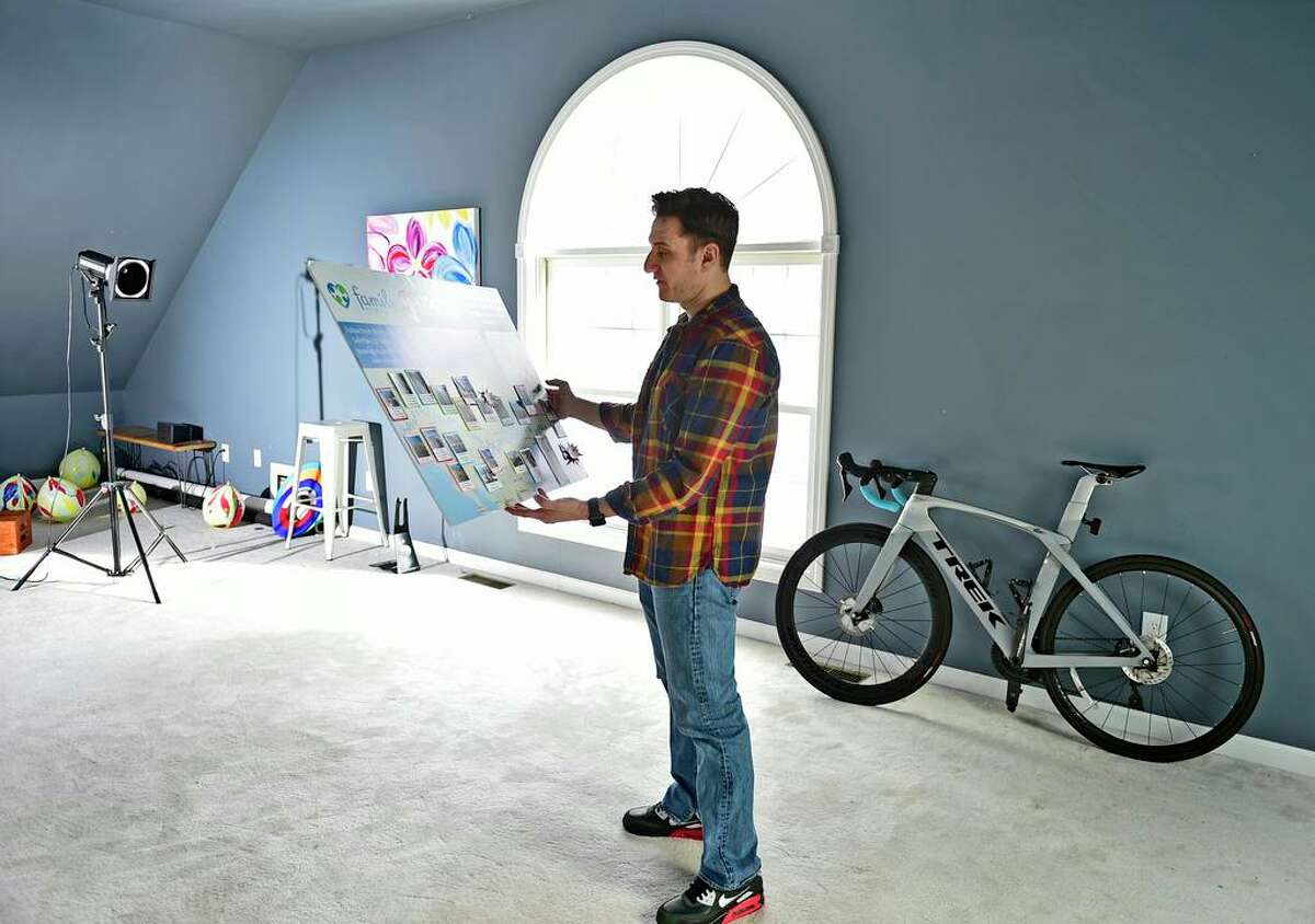 Photographer Noah Ehlert, of Guilford, looking at a diorama of his bike journey to California Family Recources' SAfePlace2B shelter, where he lived as an 11-year-old runaway, returning to share his story while inspiring homeless children there and at other youth shelters to discover their path to success. He wanted to bring message of hope that they can achieve their dreams. Founder, Discover Your Path, Inc.