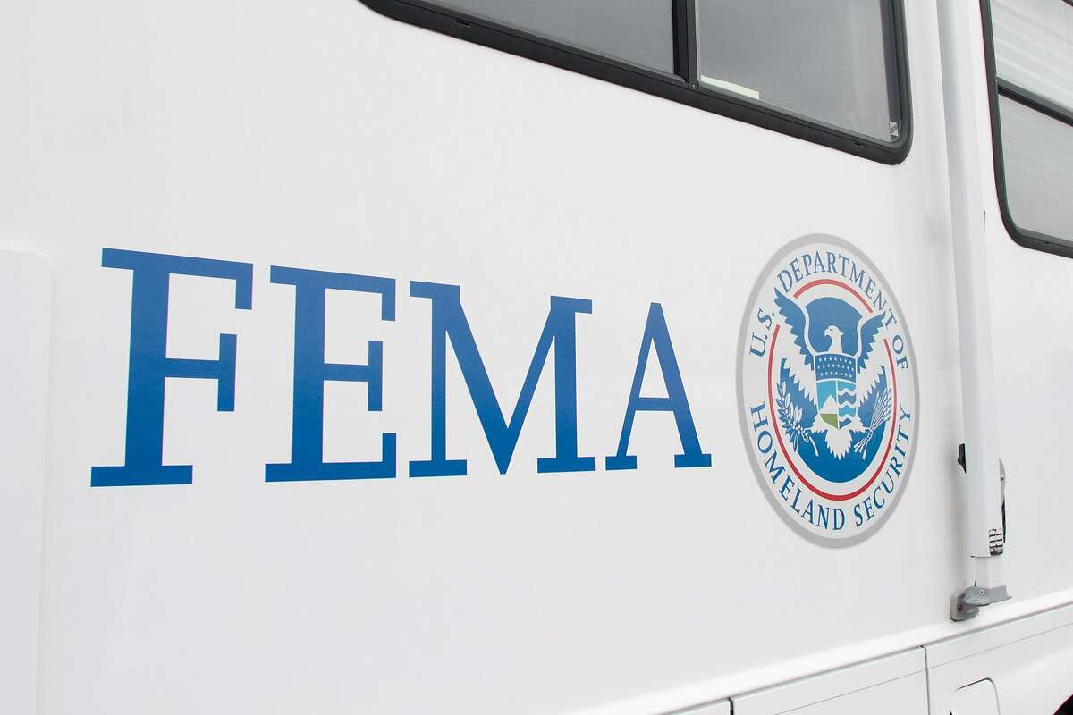 A FEMA (Federal Emergency Management Authority) trailer sits at the COVID-19 mass vaccination site opened to the public at the Oakland-Alameda Coliseum Complex in Oakland, Calif. on Feb. 16, 2021. The trailer will travel to low income communities in the Bay Area to deliver vaccine shots. The vehicles will be able to administer 250 vaccine shots at a time.