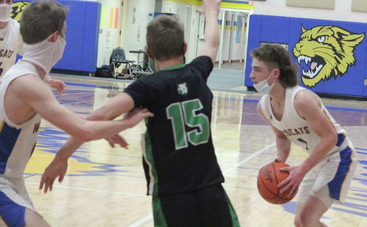 Brayden Cass, of Evart, looks to make a play against Houghton Lake. (Herald Review/John Raffel)