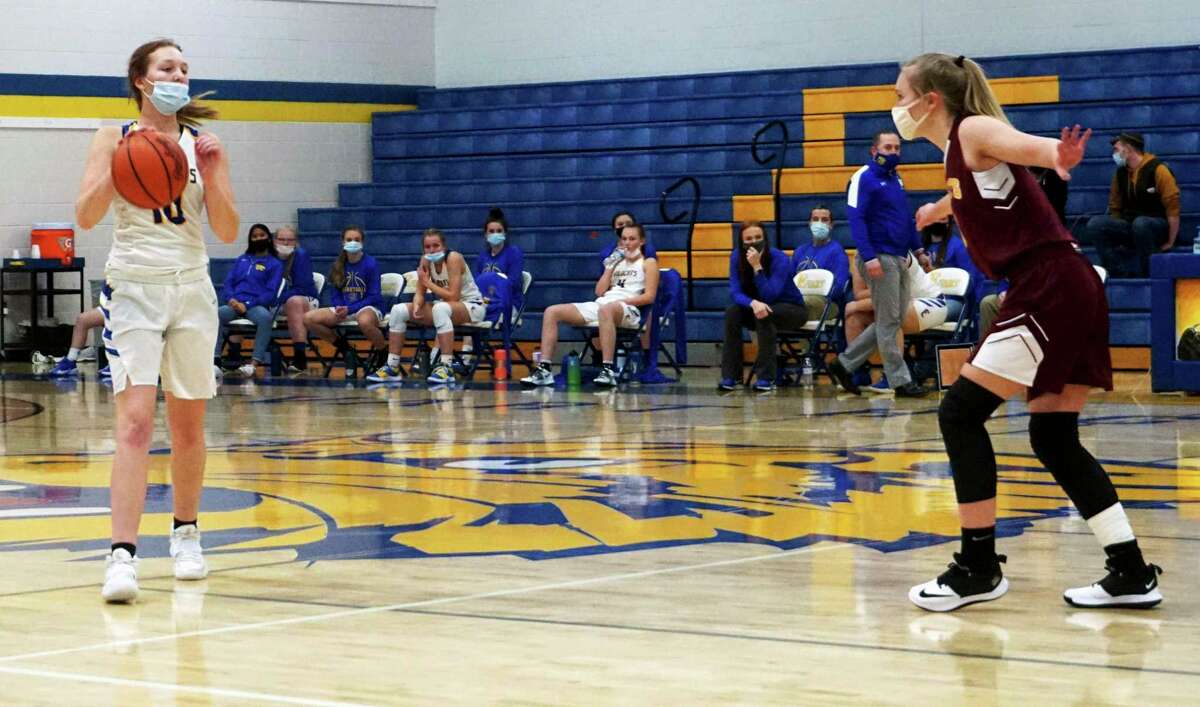 Evart's Addy Gray weights her options against the NMC defense in Wednesday's loss to NMC. (Herald Review photo)