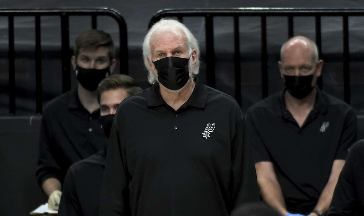 San Antonio Spurs head coach Gregg Popovich looks on from the bench during the second half of an NBA basketball game against the Portland Trail Blazers in Portland, Ore., Monday, Jan. 18, 2021. The Spurs won 125-104.