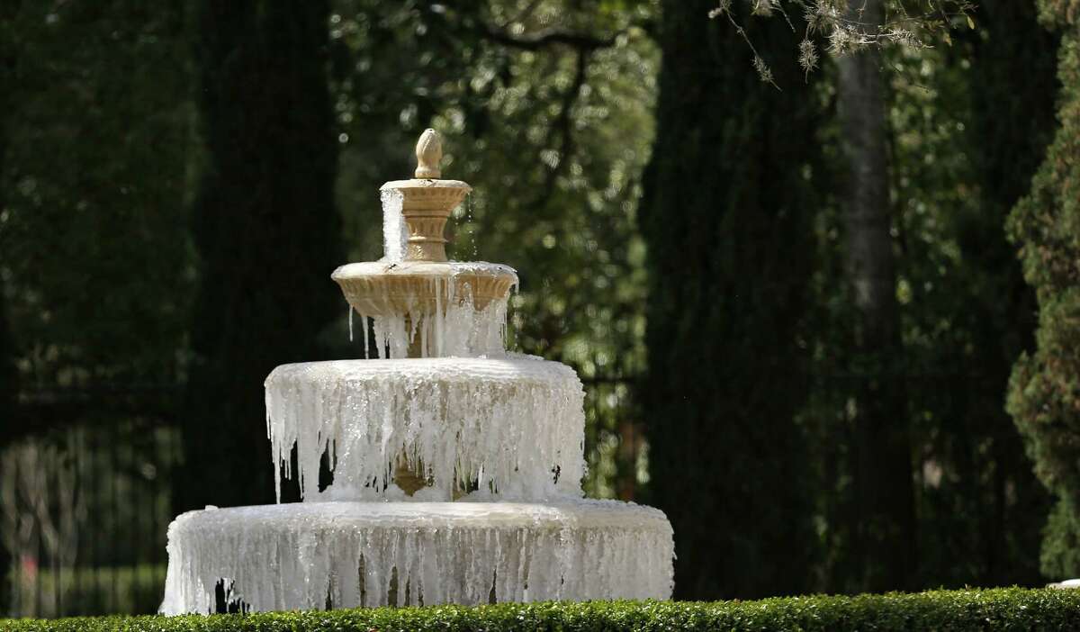 A front yard water fountain that remained on during the Arctic blast freezes in Houston on Monday, Feb. 15, 2021.