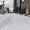 Downtownn Beaumont was deserted early Monday morning as Southeast Texans awoke to frigid temperatures and iced cars and roadways after the arctic front moved in overnight. Photo taken Monday, February 15, 2021 Kim Brent/The Enterprise