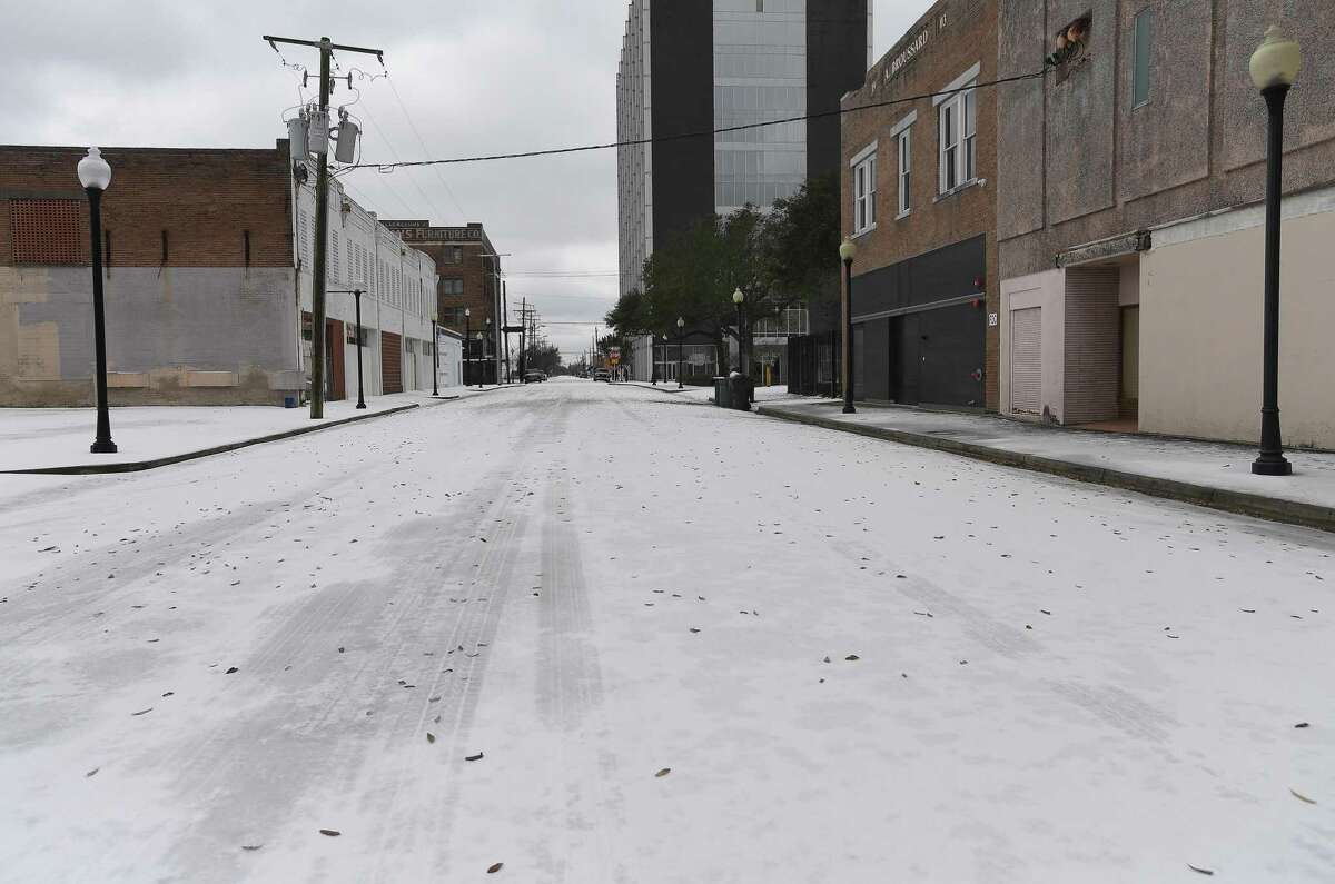 Downtownn Beaumont was deserted early Monday morning as Southeast Texans awoke to frigid temperatures and iced cars and roadways after the arctic front moved in overnight. Photo taken Monday, February 15, 2021 Kim Brent/The Enterprise