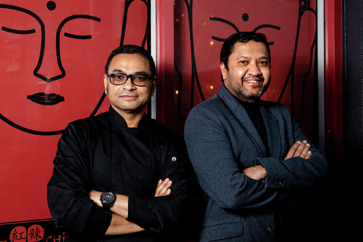 Chef Bharat Dhamala, left, and owner Snehal Patel, right, of Red Hot Chilli Pepper restaurant in San Carlos.