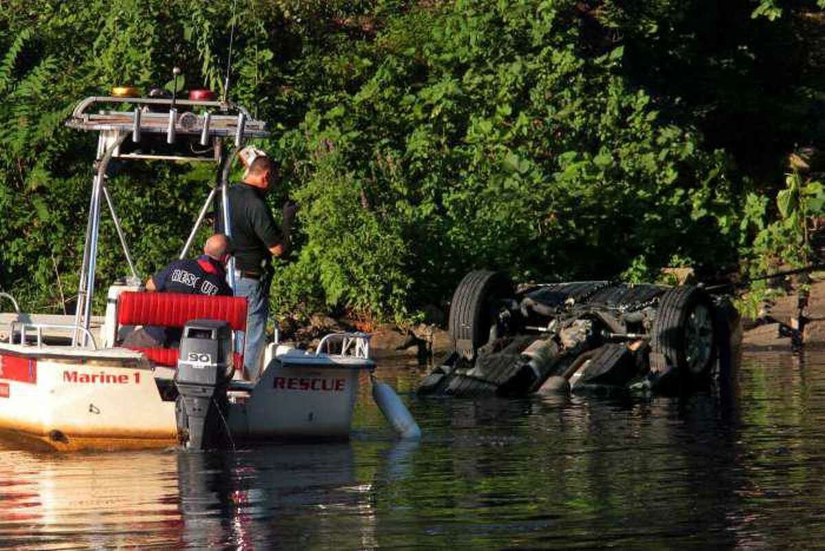 Officials investigating after a vehicle was driven in to the Housatonic River in Seymour, Conn., on Friday, July 31, 2020.