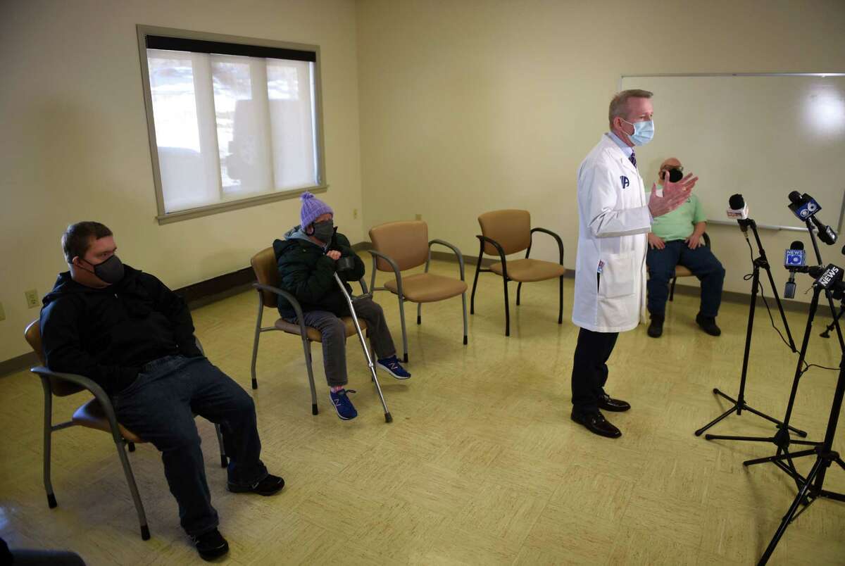 Dr. Dennis P. McKenna, president and CEO of Albany Medical Center, answers questions during a vaccination clinic at the Center for Disability Services on Wednesday, Feb. 17, 2021, in Albany, N.Y. Albany County and Albany Medical Center, with the approval of the New York State Health Department, allocated 450 dosages of the Moderna COVID-19 vaccine to be administered to people who live in groups homes for persons with intellectual and developmental disabilities, as well as the workers who care for them. (Will Waldron/Times Union)