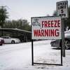 A sign warns of frozen pipes in Dallas on Sunday, Feb. 14, 2021. At least 2.5 million customers, most of them in Texas, had lost electricity by early Monday as weather advisories extended from coast to coast. (Nitashia Johnson/The New York Times)