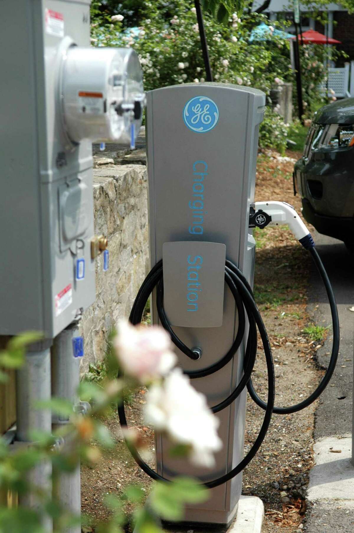 The state’s participation in a regional climate initiative, selling emission credits to fossil fuel companies to raise a billion dollars by 2032, would be used to support transportation projects including the installation of more electric vehicle chargers.
