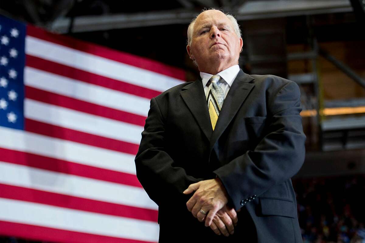 US radio talk show host and conservative political commentator Rush Limbaugh looks on before introducing US President Donald Trump to deliver remarks at a Make America Great Again rally in Cape Girardeau, Missouri. 