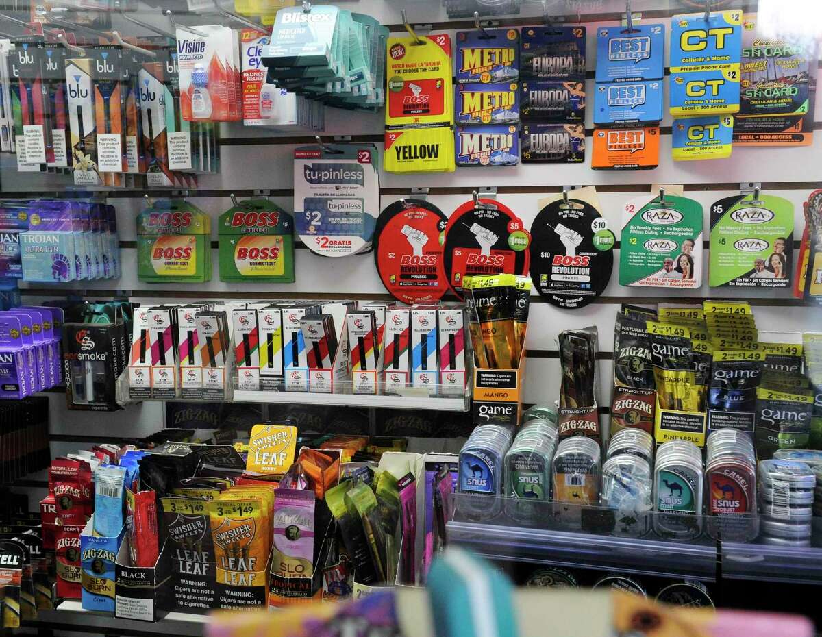 A display at Stamford Photo and News on Jan, 8, 2020 in Stamford, Conn., is filled with an assortment of products, including e-vaping and tobacco products, that the retailer offers for sale.