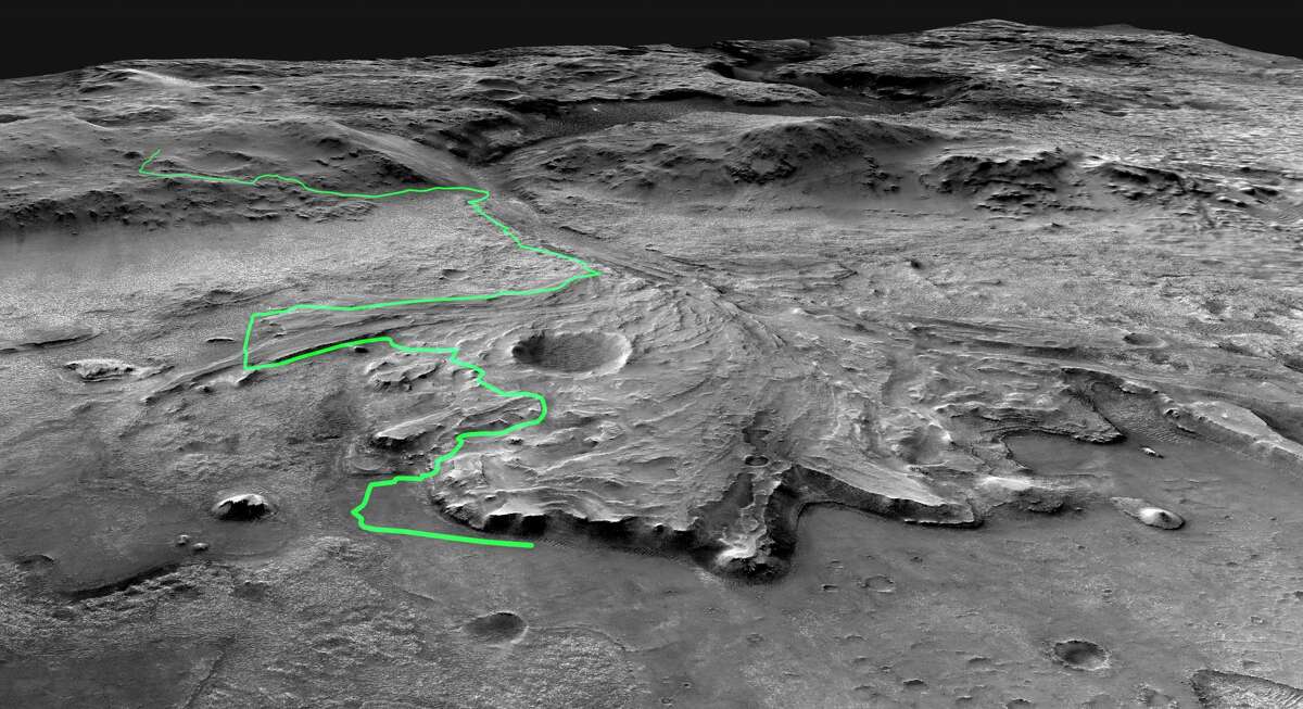 This illustration depicts a possible area through which the Mars 2020 Perseverance rover could traverse across Jezero Crater as it investigates several ancient environments that may have once been habitable. The route begins at the cliffs defining the base of a delta produced by a river as it flowed into a lake that once filled the crater. The path then traverses up and across the delta toward possible ancient shoreline deposits and then climbs the 2,000-foot-high crater rim to explore the surrounding plains. About half of this journey could be completed in Perseverance's prime mission (one Mars year, or two Earth years). For reference, the prominent crater near the center of the image is about 0.6 miles across.