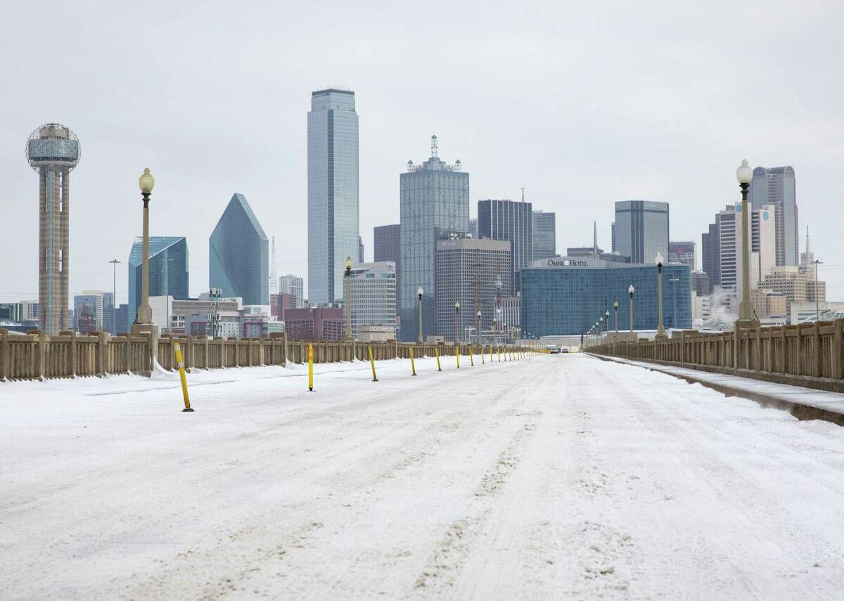 A snow-covered downtown Dallas seen from South Houston Street on Monday, Feb. 15, 2021. (Juan Figueroa/The Dallas Morning News/TNS)