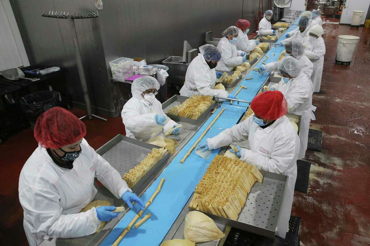 An assembly lines wraps tamales at Nuevo Garcia Foods. Workers wrapped more than 5 million tamales from October through December.