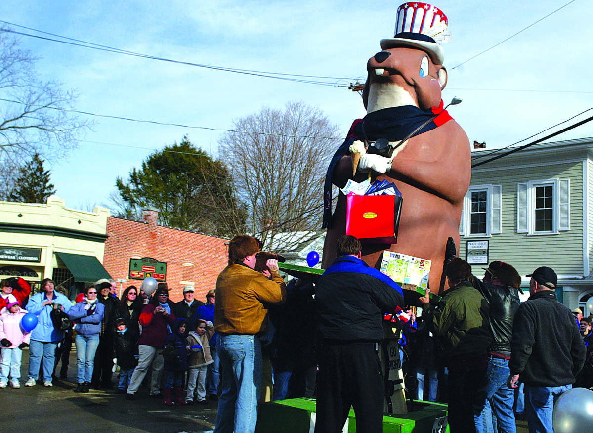 Essex Ed is lifted onto a platform in the center of Essex at the end of the parade Sunday afternoon.......photo by Sarah Schultz.....1.30.05