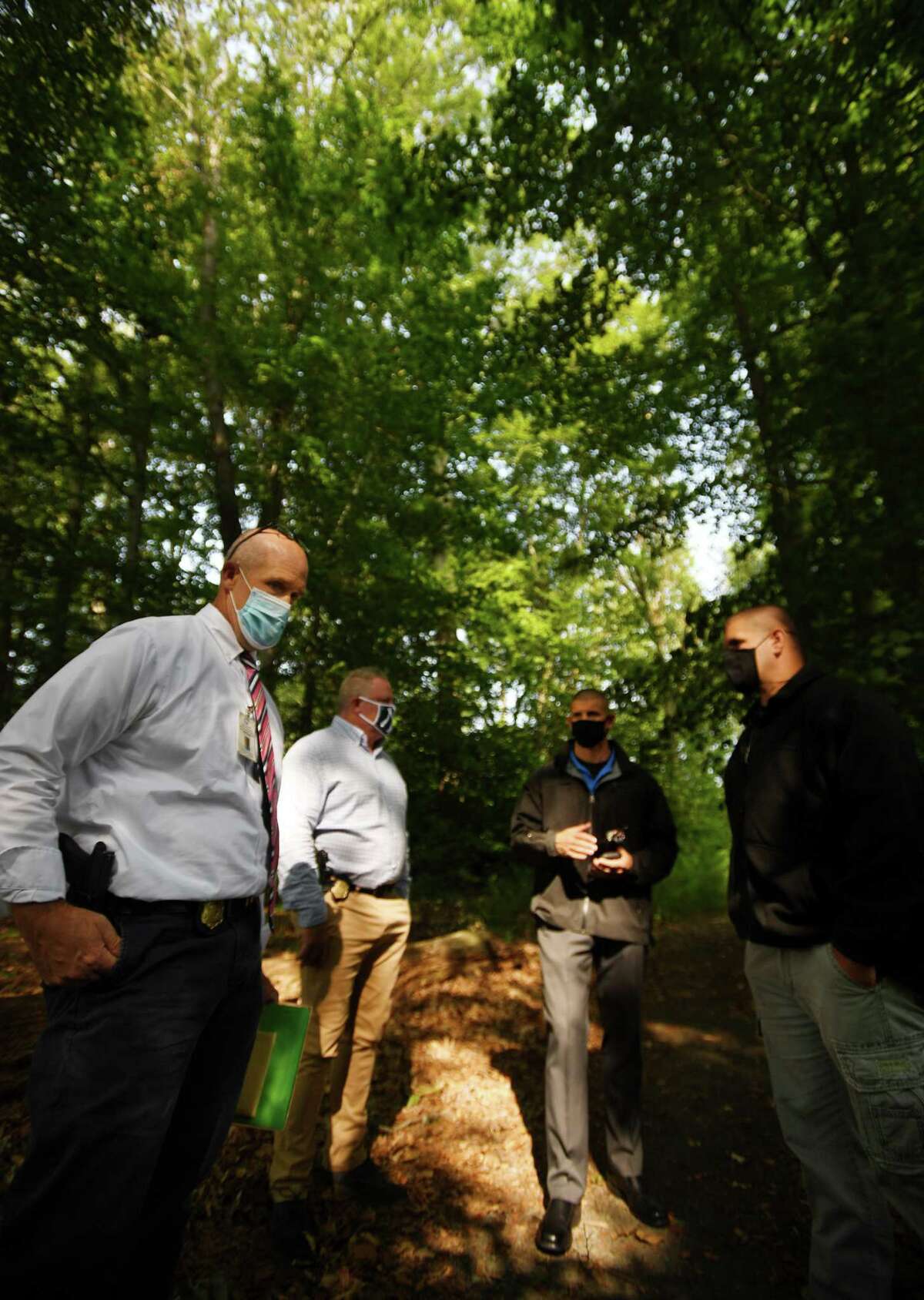 From left; Detective Andrew Jacobson, Detective Kevin Salkeld, Sgt. Anthony Rykowski, and Sgt. Mike Rykowski revisit the scene of the 1982 unsolved murder of Sylvia Baker in Keney Park in Hartford, Conn. on Wednesday, September 16, 2020. Baker, who was strangled, was found on the shore of the nearby Keney Park Pond.