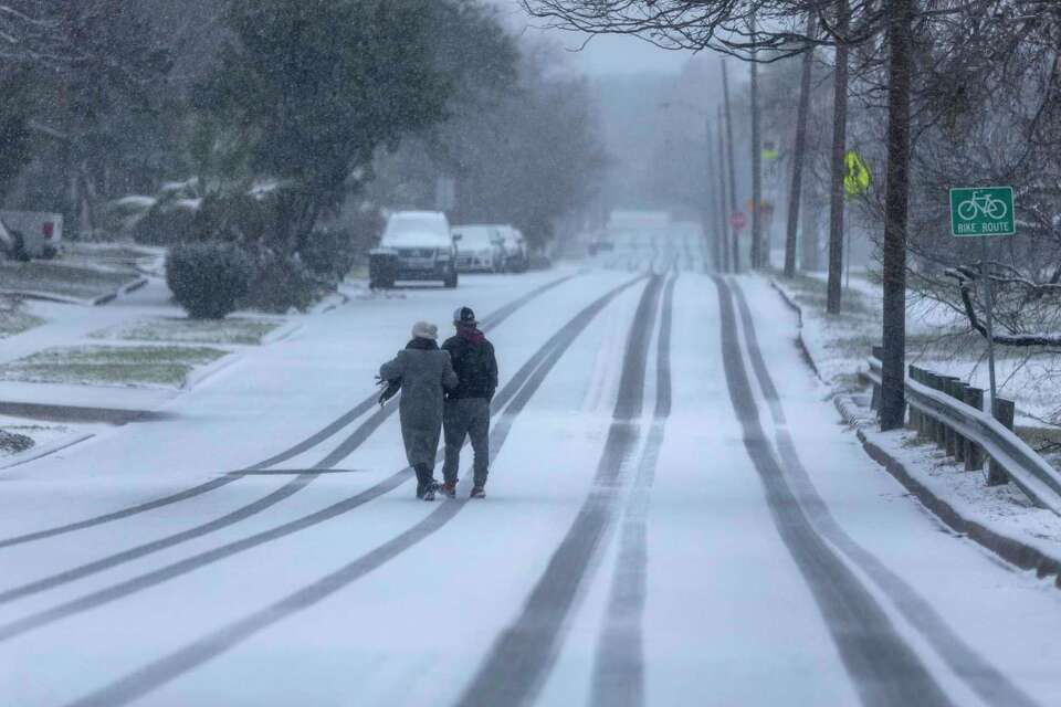 Photos show snow falling in San Antonio, Texas