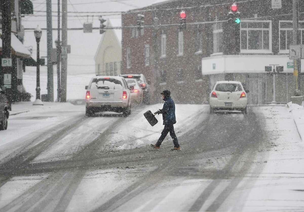 A winter storm coats streets in a fresh layer of snow in Milford, Conn. on Thursday, February 18, 2021.