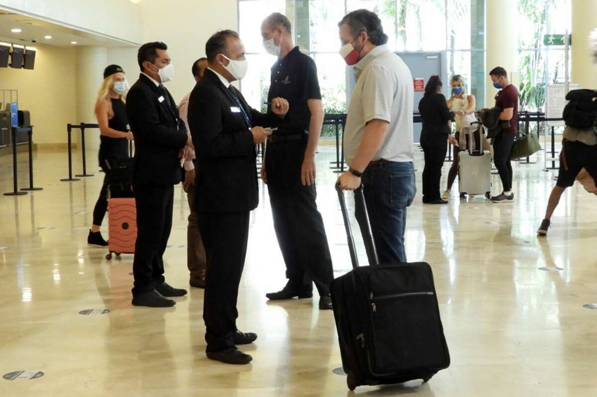 CANCUN, MEXICO - FEBRUARY 18: Sen. Ted Cruz (R-TX) checks in for a flight at Cancun International Airport after a backlash over his Mexican family vacation as his home state of Texas endured a Winter storm on February 18, 2021 in Cancun, Quintana Roo, Mexico. The Republican politician came under fire after leaving for the warm holiday destination as hundreds of thousands of people in the lone star state suffered a loss of power. Reports stated that Cruz was due to catch a flight back to Houston, Texas. (Photo by MEGA/GC Images)