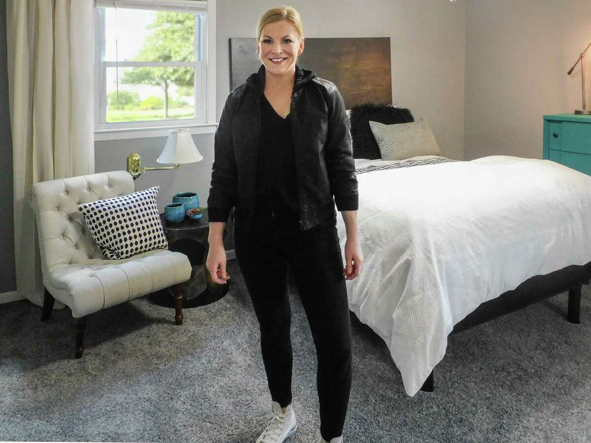 Taylor Spellman in a bedroom she designed, she stars on “One Week to Sell” on Discovery +.