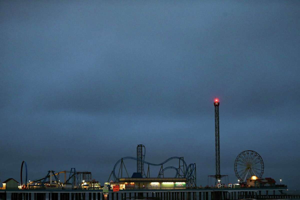 Carnival ride lights remain off on Galveston Pier as much of the island struggles with power outages on Wednesday, Feb. 17, 2021.