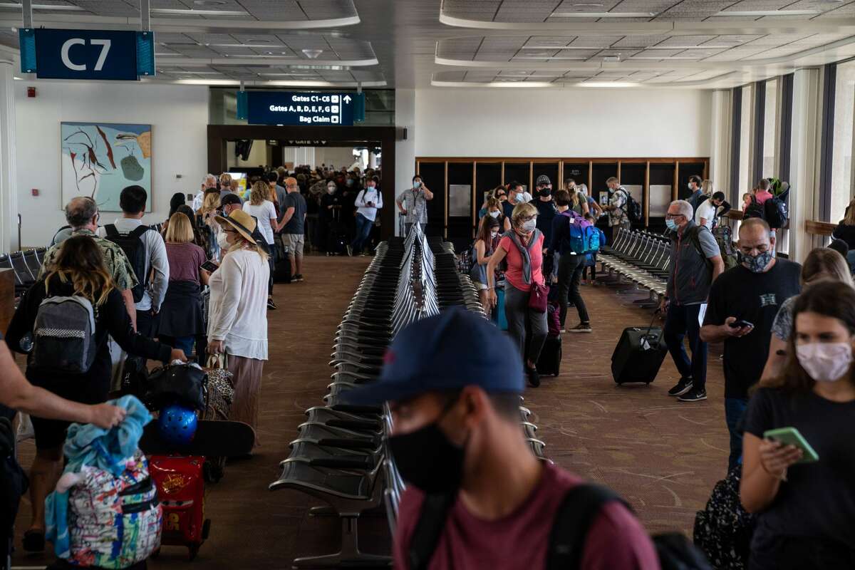 Many arriving passengers faced long waits as state officials checked to be sure all arrivals had answered a health questionnaire, had their temperatures taken and shown proof of a negative COVID test, at Daniel K. Inouye International Airport.