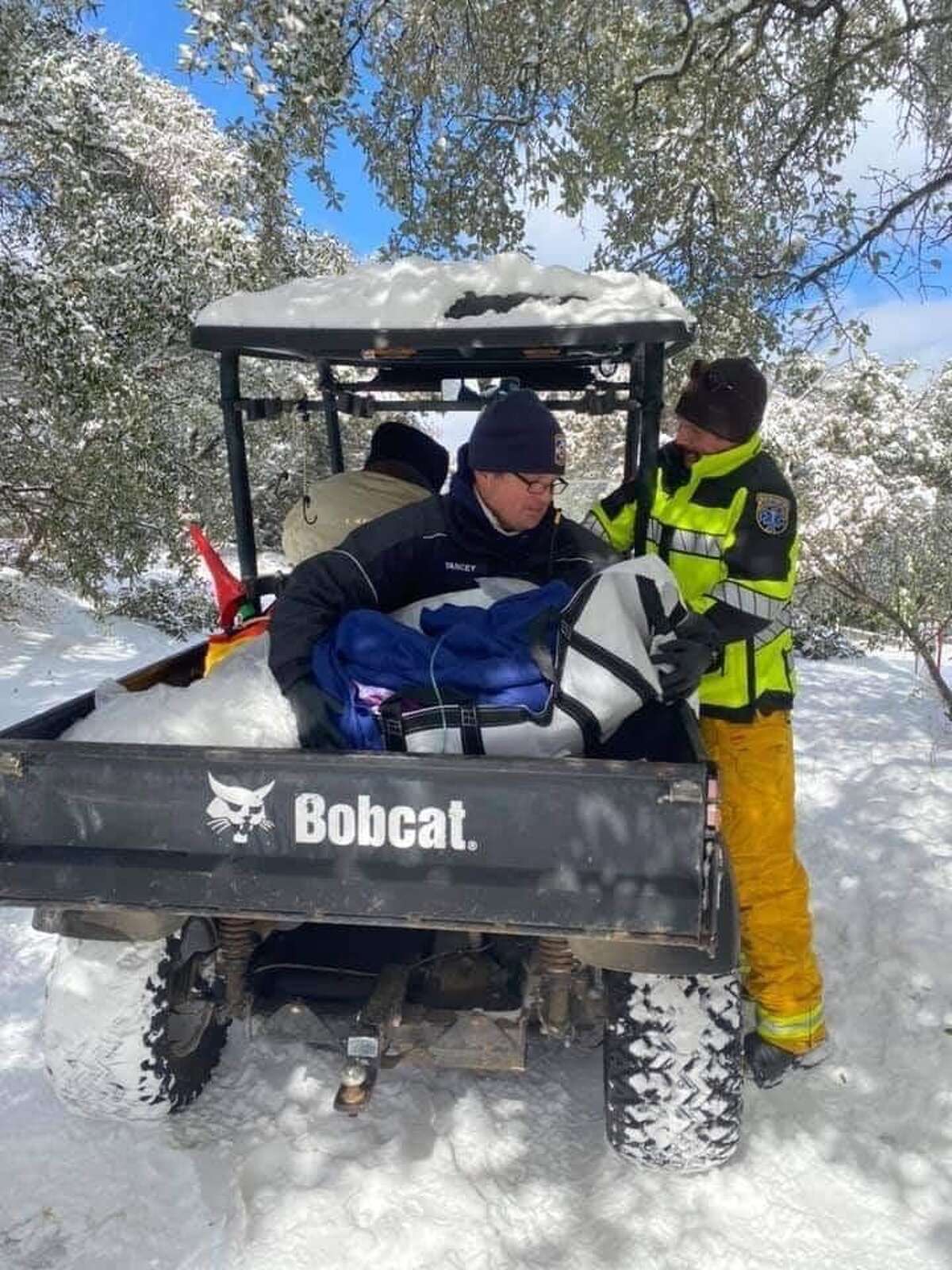With an ambulance stuck in the snow, Austin paramedics had to resort to warming a 98-year-old patient in a utility vehicle.