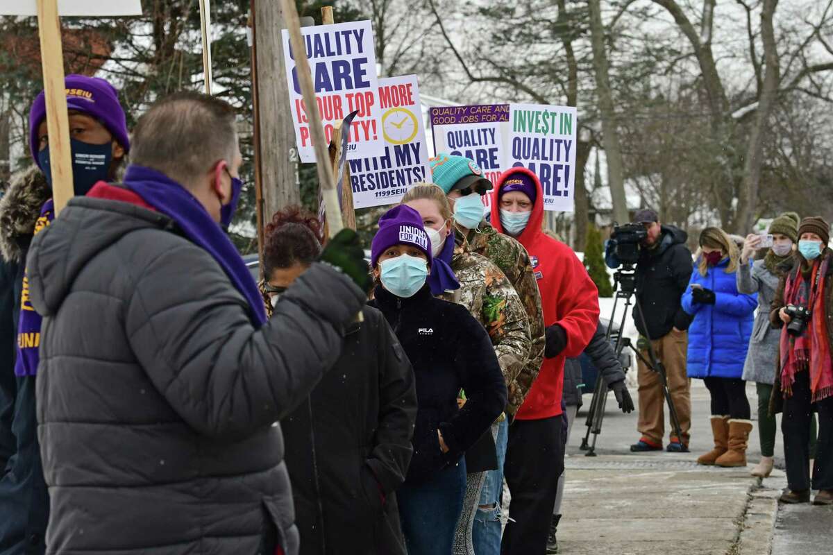 1199SEIU nursing home workers hold a demonstrations at the entrance to the Schenectady Center for Rehabilitation and Nursing on Thursday, Feb. 18, 2021 in Schenectady, N.Y. Nursing home workers are holding demonstrations and vigils at more than 20 nursing homes across New York State, calling for greater transparency and investment in quality resident care. (Lori Van Buren/Times Union)
