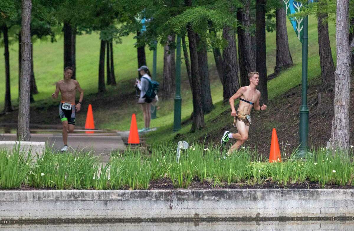 The Muddy Trails Bash run and the Woodforest Bank TRI triathlon have both been canceled and replaced with a new run — The 4-3-21 Run and Done 3.1 — which will be hosted at The Woodlands Waterway with a 7 a.m. start time on Saturday, April 3. The race will have a participatant limit of 300 runners to maintain new safety protocols. In this 2019 file photograph, Arizona State sophomore Lane Barron rounds a corner of the course during the modified Woodforest Bank TRI.