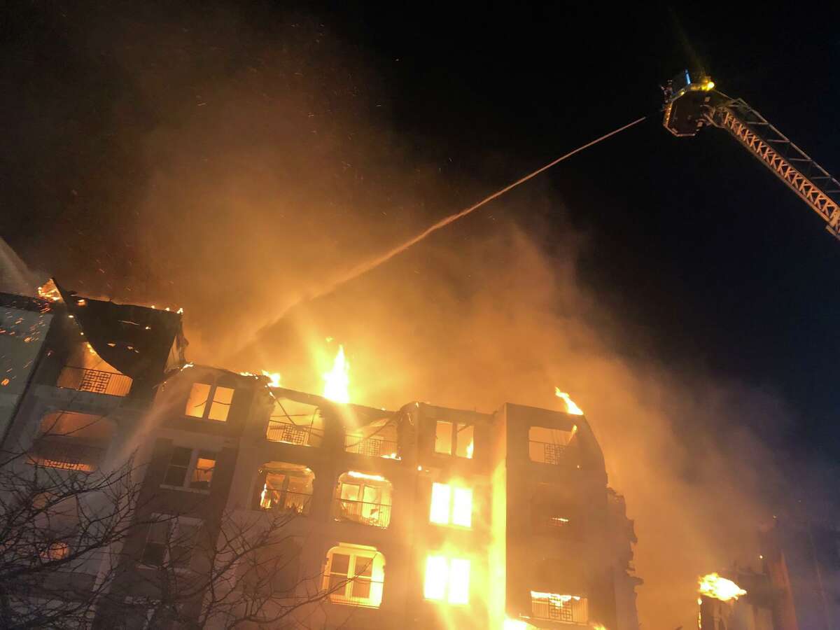 Firefighters work to control a fire as it engulfs a building Thursday night at the Cortland View at TPC apartments, 4092 TPC Parkway. There were no injuries, according to the Bexar-Bulverde Volunteer Fire Department.