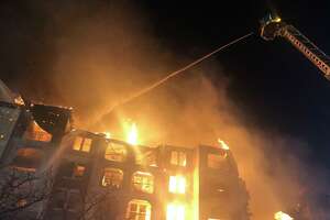 Fire engulfs apartment building as lack of water hampers efforts