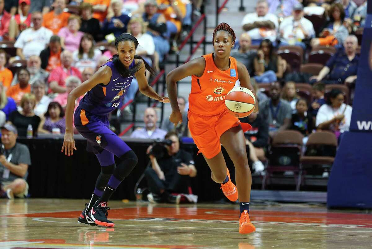 Connecticut Sun guard Bria Holmes (32) and Phoenix Mercury forward DeWanna Bonner (24) in action during a WNBA game in 2019.