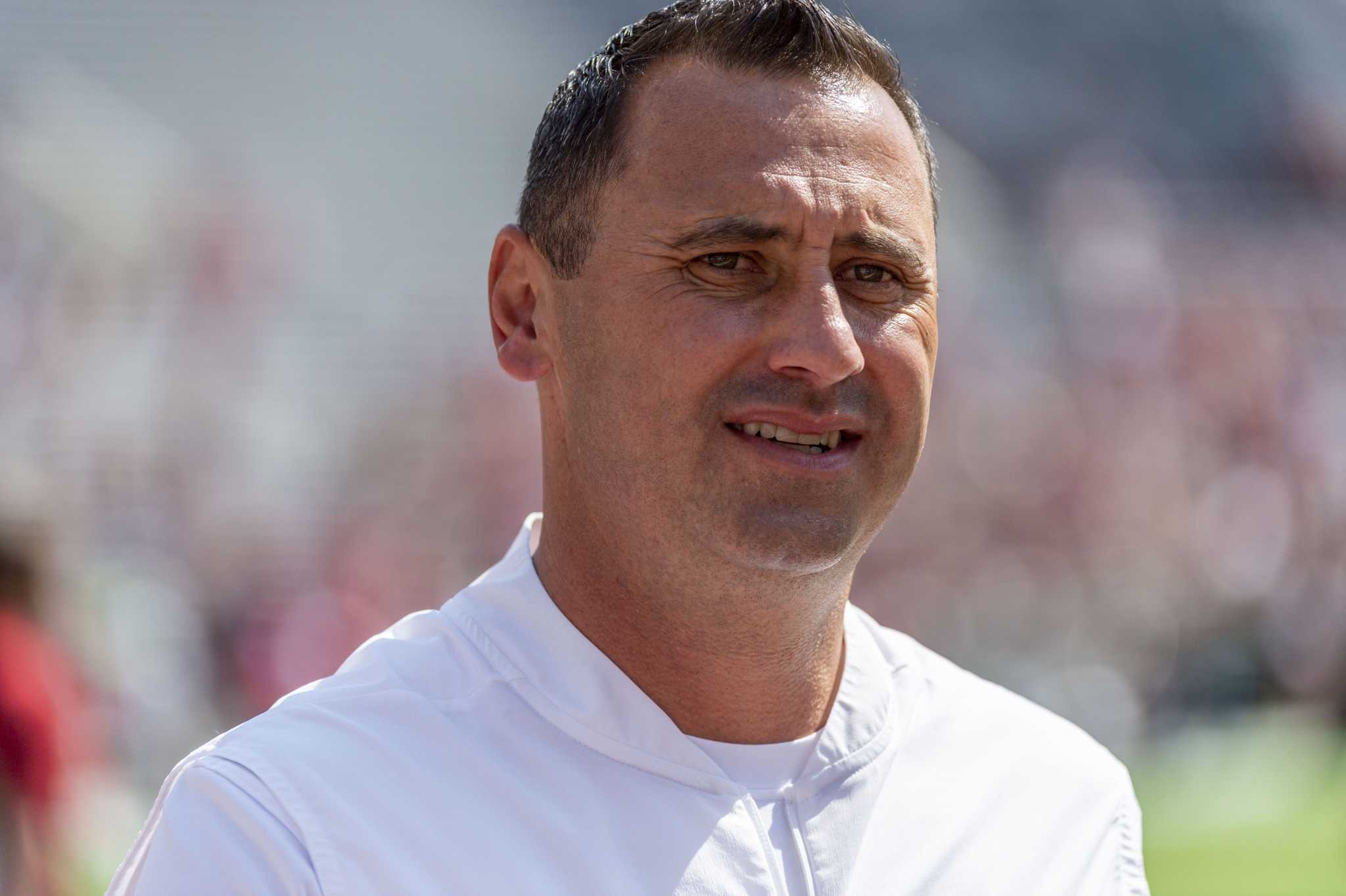 Recruiting Texas' Steve Sarkisian takes care of home, looks to the West