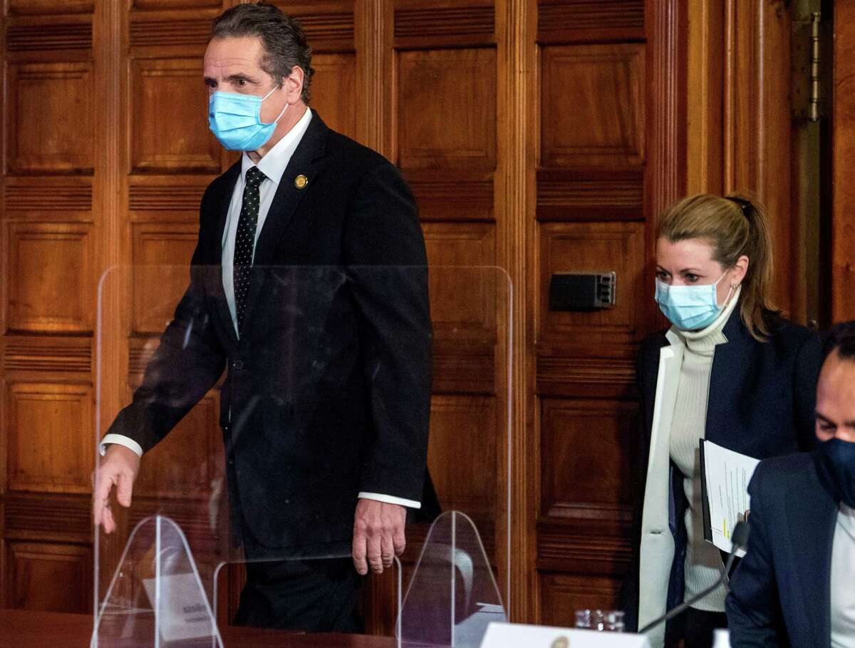 Gov. Andrew Cuomo appeared in public for the first time Wednesday, March 3, with a coronavirus briefing from the state Capitol. Pictured: he enters a coronavirus press briefing with aide Melissa DeRosa, center, on Wednesday, Feb. 10, 2021, at the Capitol in Albany, N.Y. (Office of the Governor)