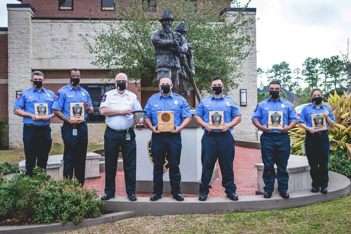 Spring Fire Department's 2020 Firefighters of the Year hold their awards in front of the Spring Firefighter Memorial. From left to right: John Nanninga, Sterling Davis, Scott Seifert, Keith Topper, Lewis Rougeou and Cristina Romero.