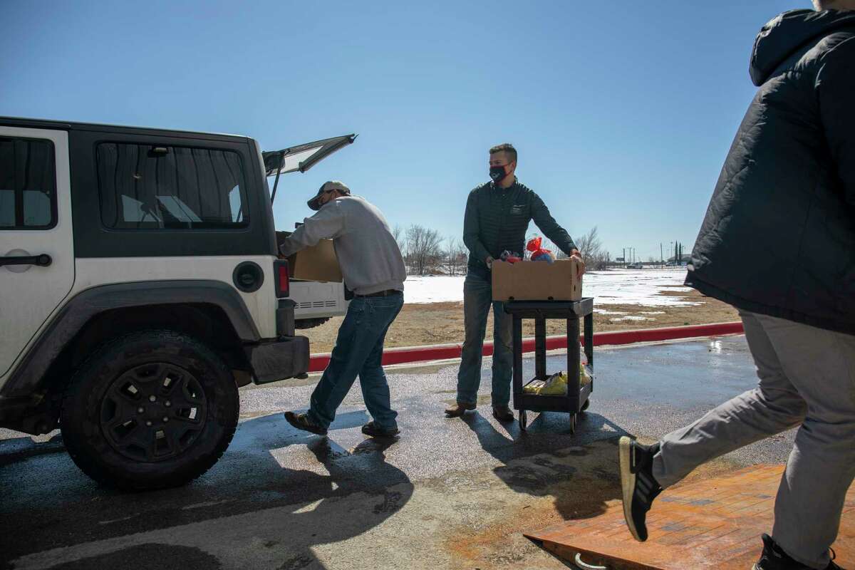 Volunteers help distribute food after the winter storm Friday, Feb. 19, 2021 at West Texas Food Bank. Jacy Lewis/ Reporter-Telegram