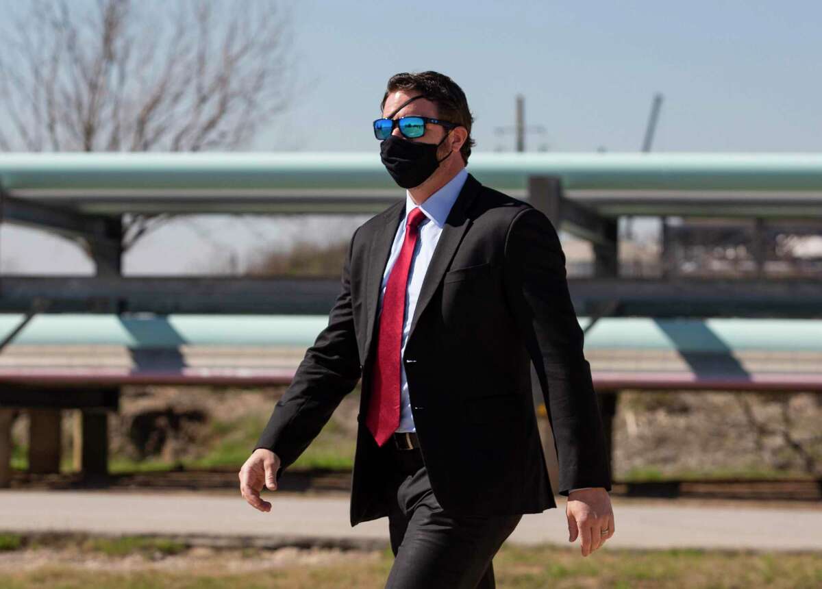 U.S. Representative Dan Crenshaw arrives a press conference following a roundtable with Texas oil and gas workers to talk about the negative impact President Joe Biden’s energy policies Tuesday, Feb. 2, 2021, at Houston Ship Channel in Houston.