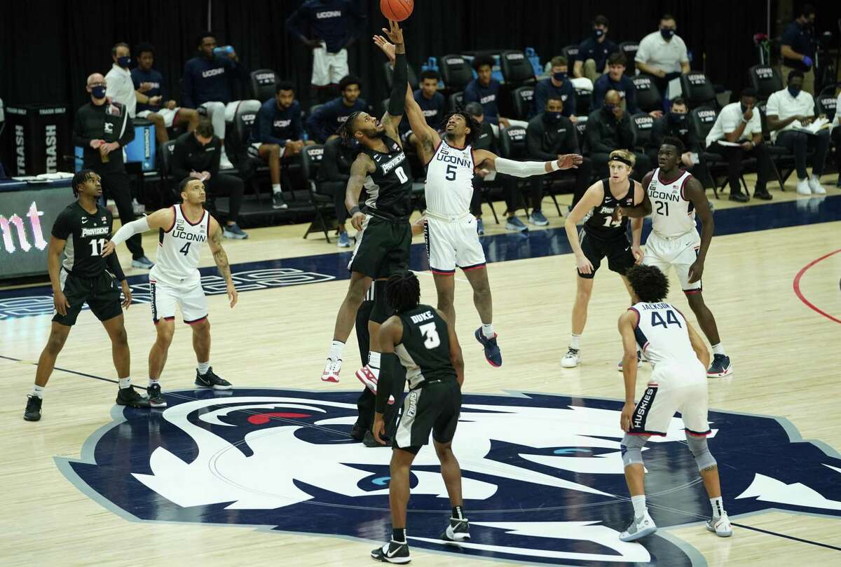 Feb 16, 2021; Storrs, Connecticut, USA; Connecticut Huskies forward Isaiah Whaley (5) tips off against Providence Friars center Nate Watson (0) at Harry A. Gampel Pavilion. Mandatory Credit: David Butler II-USA TODAY Sports