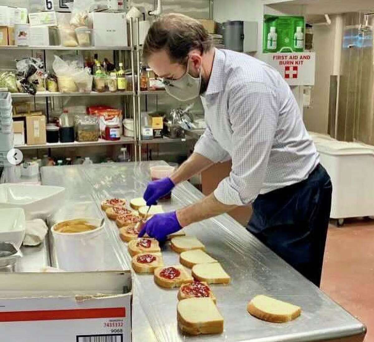 Michael McClellan, director of food and beverage at the St. Anthony, makes PB&J sandwiches for hotel employees during the recent snow storm.