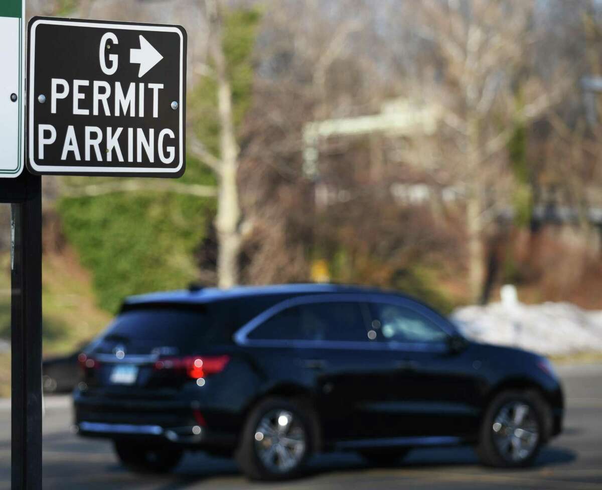 A sign points out designated permit parking at the Island Beach parking lot in Greenwich, Conn. Monday, Dec. 28, 2020. The deadline for commuter parking renewal is approaching, as well as the launch of a new permit parking program for 100 spots downtown chosen by a random lottery if there are more than 100 applicants.