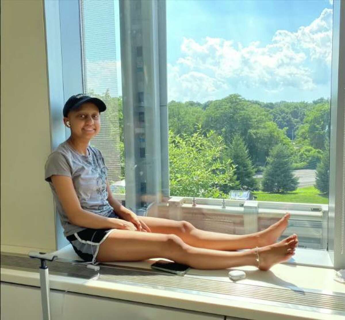 Sonia Kocinsky listens to music during a break from physical therapy.