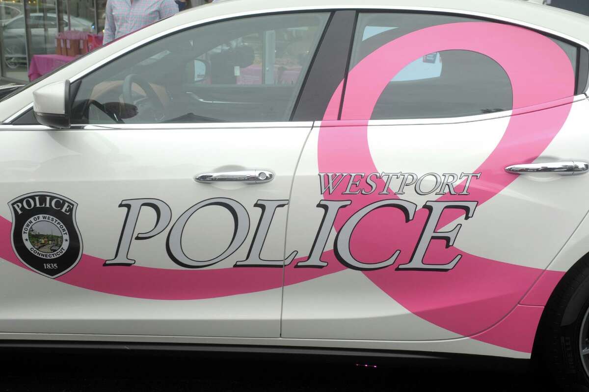A newly decorated Maserati, promoting breast cancer awareness month, was delivered to the Westport Police Department during a kick-off event at Maserati of Westport, Oct. 2, 2020.