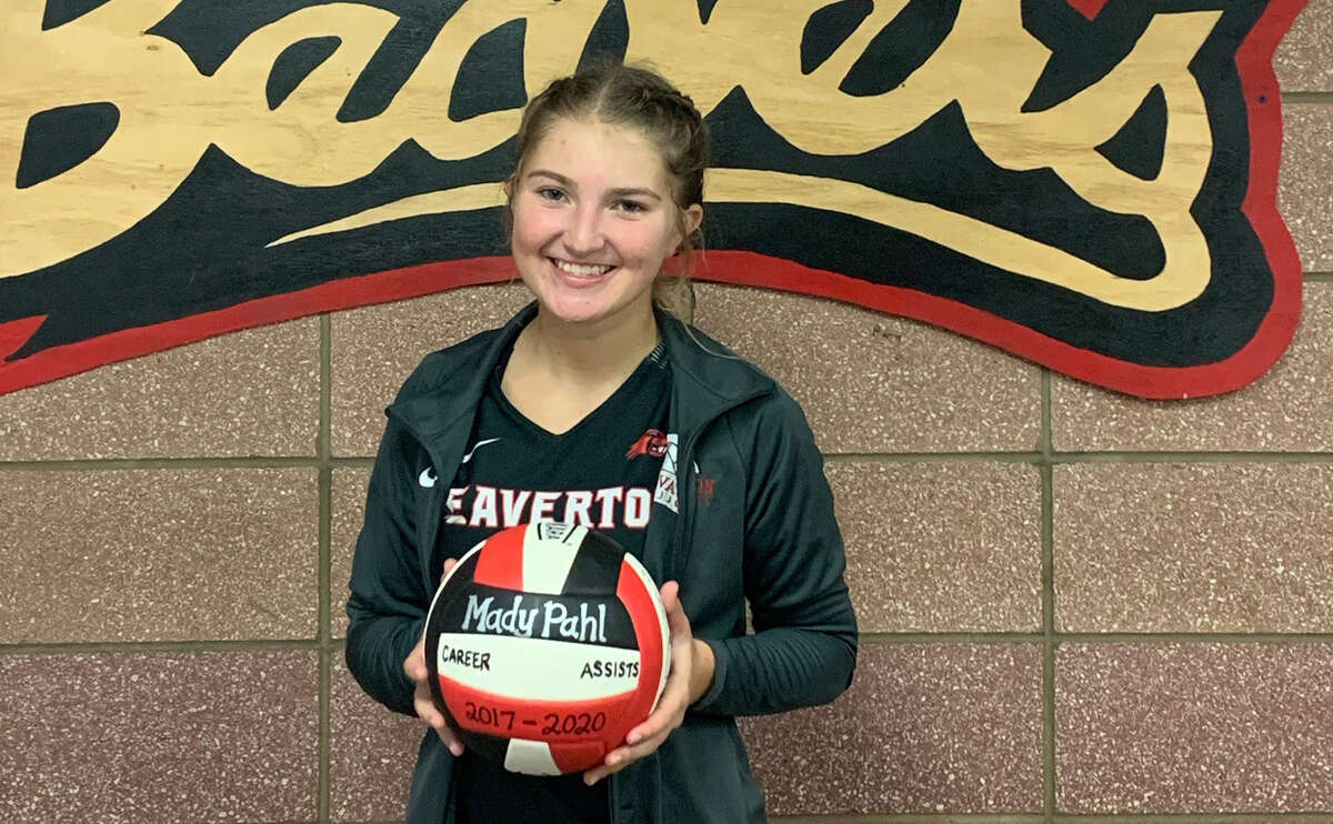 Beaverton's Mady Pahl poses with a volleyball commemorating her setting the Beavers' school record for career assists in early October 2020.