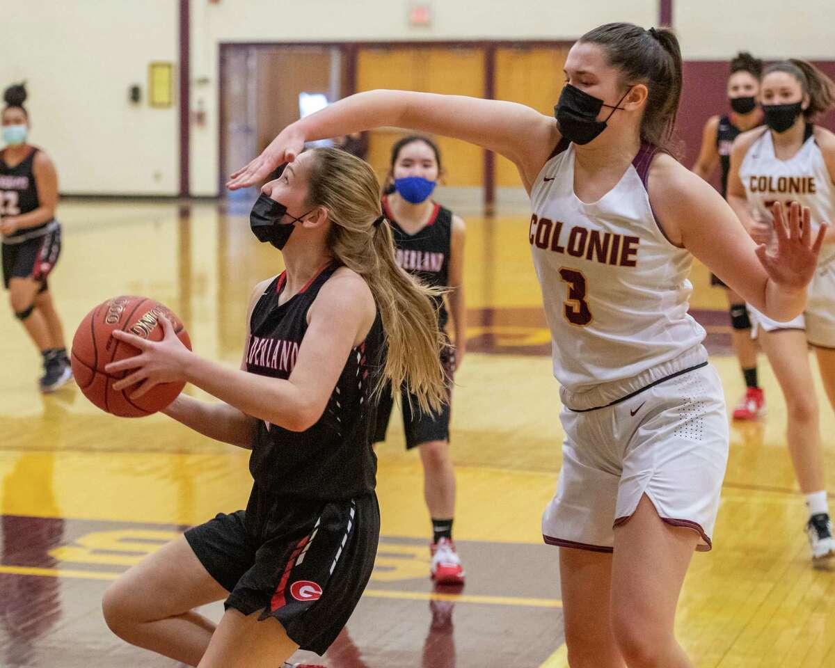 Guilderland freshman Haley Waldron makes a move to the basket in front of Colonie defender Megan Dwire during a Suburban Council matchup at Colonie High School in Colonie, NY, on Saturday, Feb. 20, 2021 (Jim Franco/special to the Times Union.)