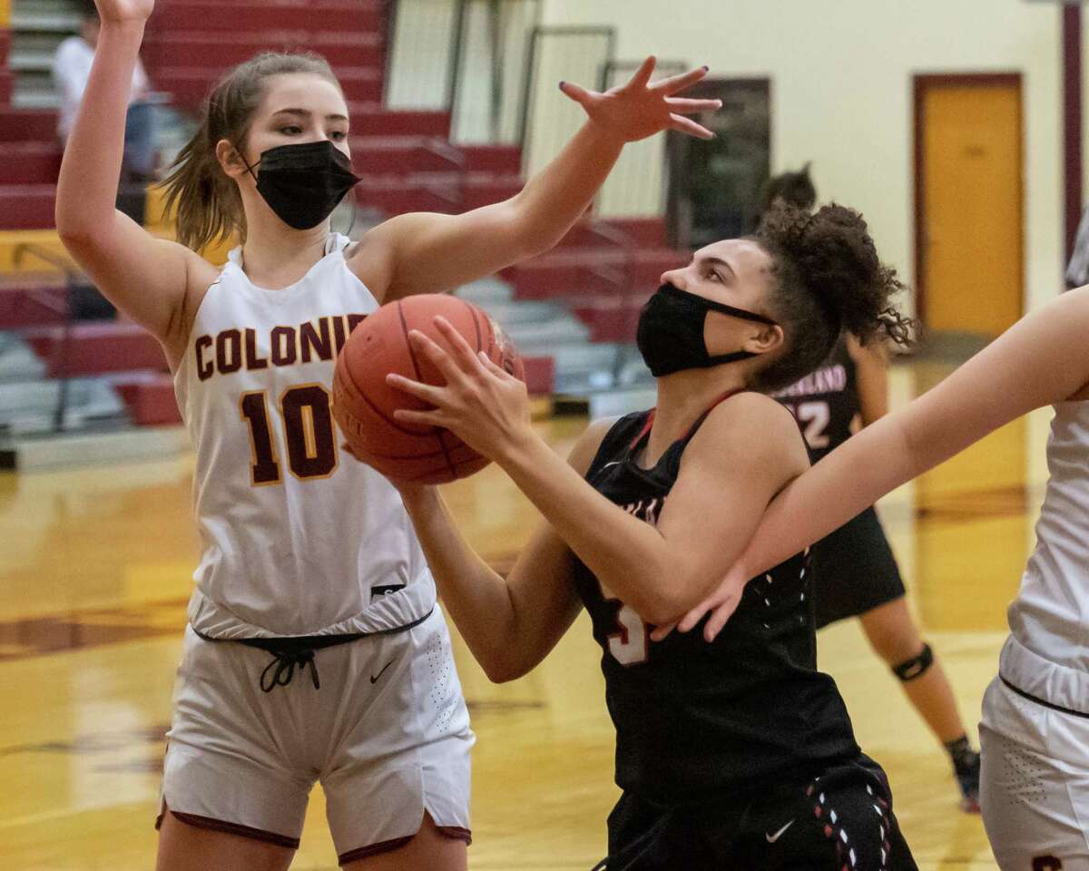 Guilderland standout Valencia Fontenelle Posson goes to the basket in front of Colonie defender Kassidy Flayter during a Suburban Council matchup at Colonie High School in Colonie, NY, on Saturday, Feb. 20, 2021 (Jim Franco/special to the Times Union.)