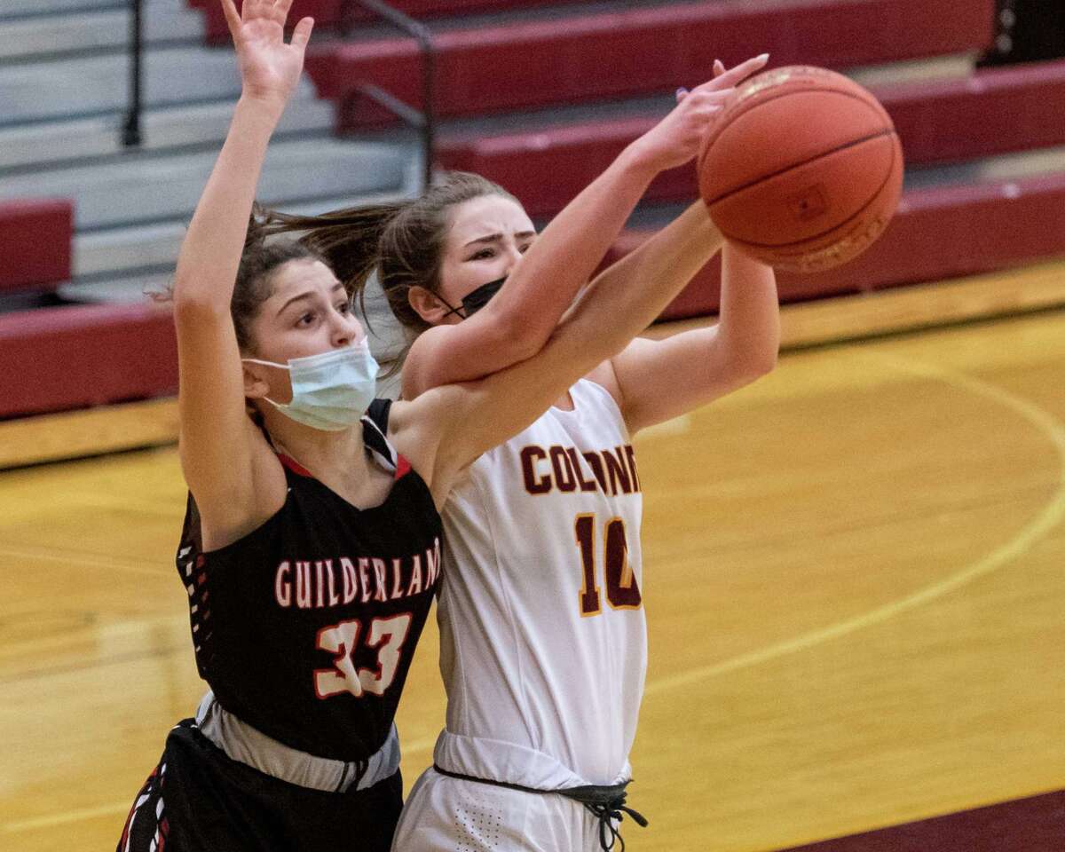 Guilderland eighth grader Eva Gitto battles with Colonie guard Kassidy Flayter during a Suburban Council matchup at Colonie High School in Colonie, NY, on Saturday, Feb. 20, 2021 (Jim Franco/special to the Times Union.)
